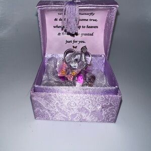 Glass elephant and butterfly figurine